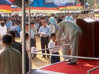 Prime Minister giving gifts to students